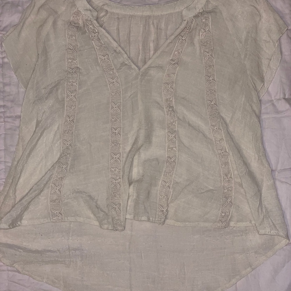 v-neck cream tunic top with flower detail